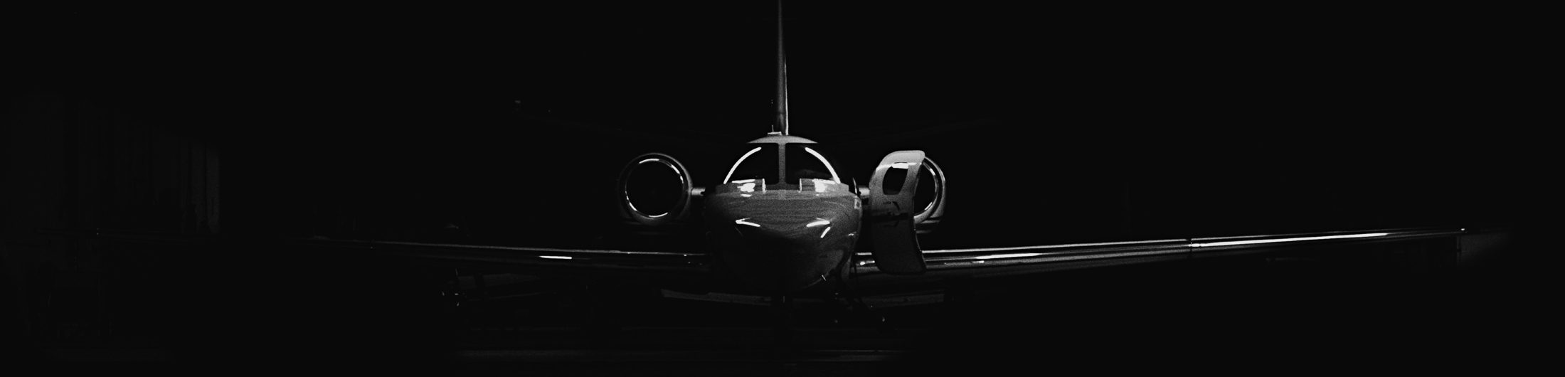 Private aircraft on a dark apron before departure